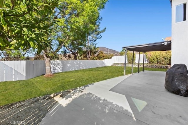 view of patio / terrace with a mountain view