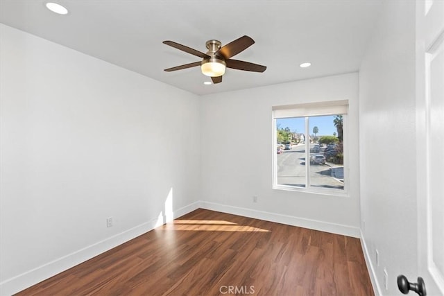 spare room featuring ceiling fan and hardwood / wood-style floors