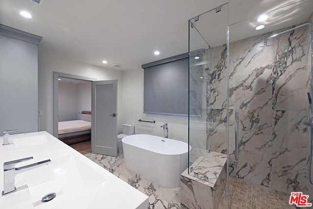 bathroom featuring sink and independent shower and bath