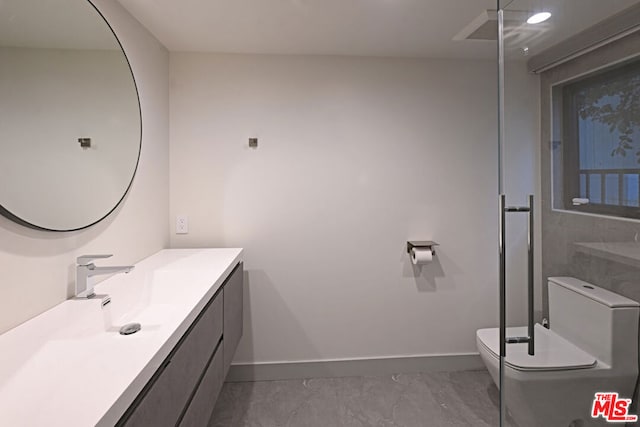 bathroom with toilet and vanity