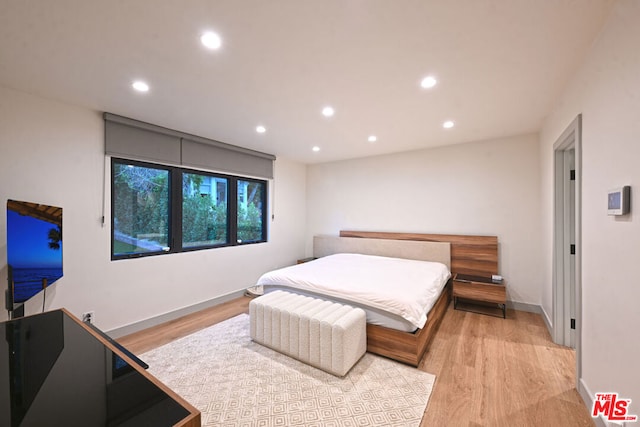 bedroom with light wood-type flooring