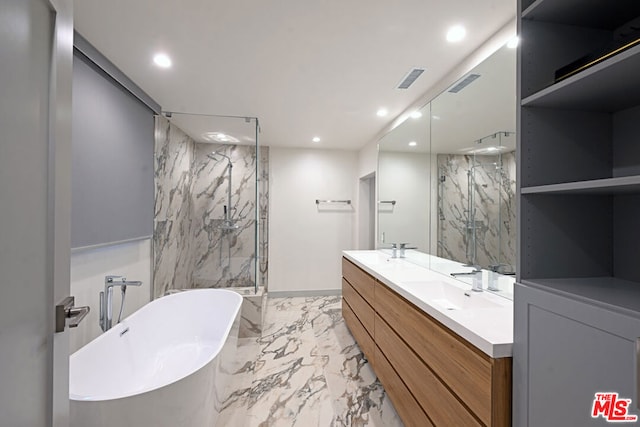 bathroom with vanity and independent shower and bath