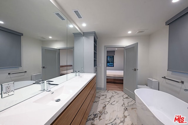 bathroom featuring vanity and a bathing tub