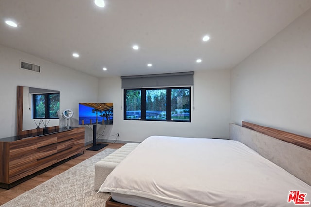 bedroom with light wood-type flooring