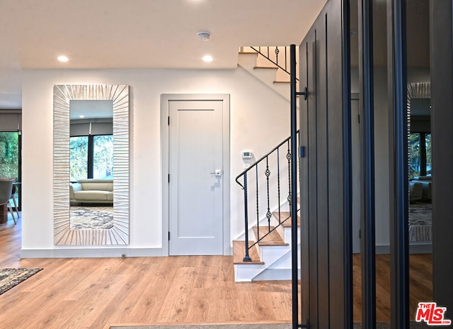 entryway with light hardwood / wood-style floors