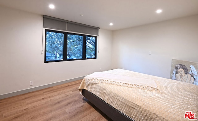 bedroom featuring light hardwood / wood-style floors