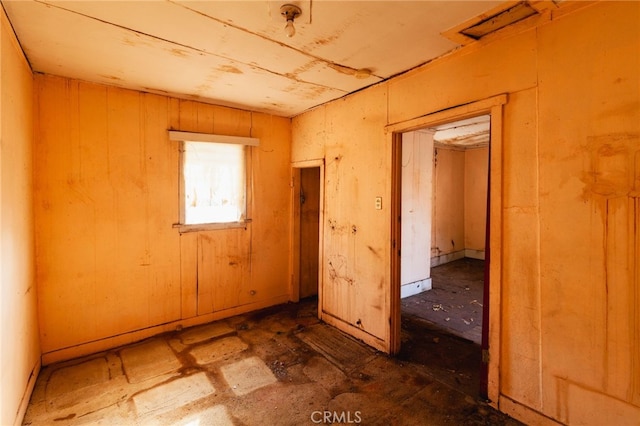 miscellaneous room with wooden walls