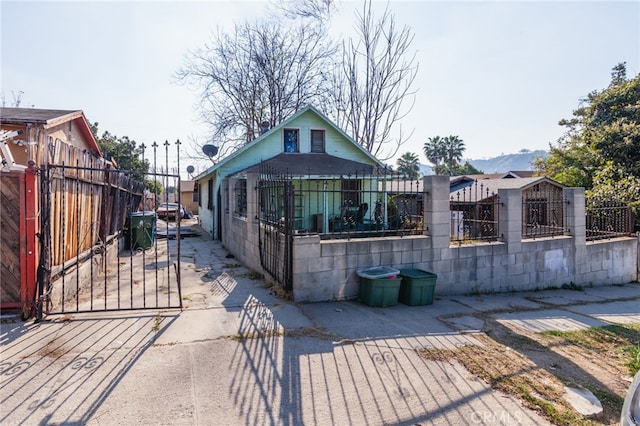 back of house with a mountain view