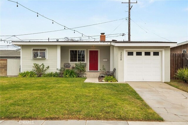 ranch-style home featuring a garage and a front yard