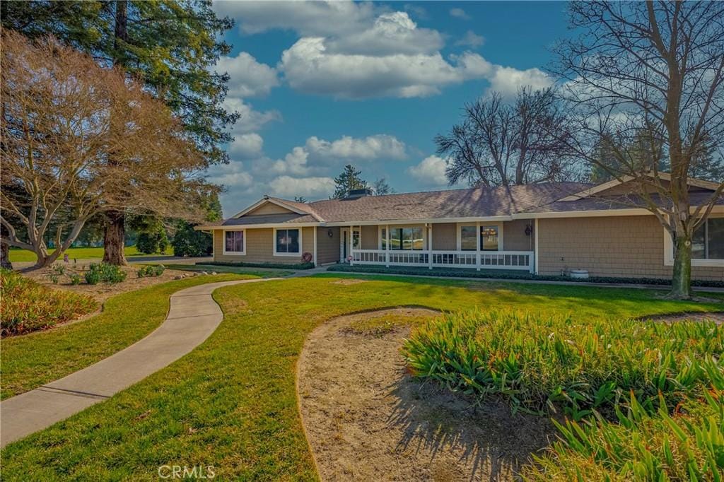 ranch-style house with a front lawn