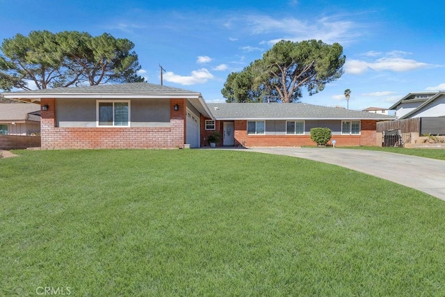 ranch-style house with a garage and a front lawn