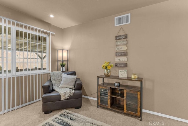 living area with carpet