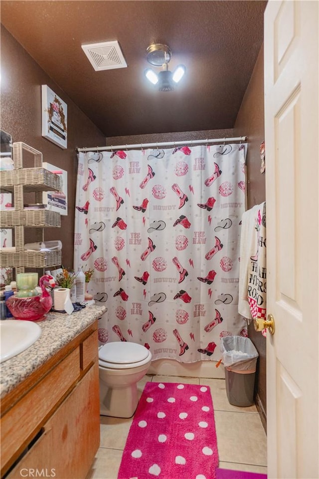 full bathroom featuring toilet, vanity, shower / tub combo with curtain, and tile patterned flooring