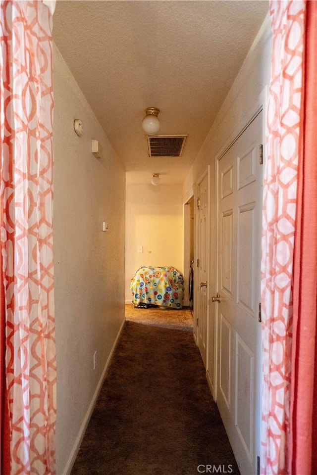 hallway featuring carpet