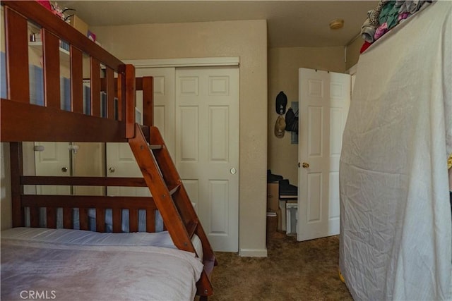 carpeted bedroom featuring a closet