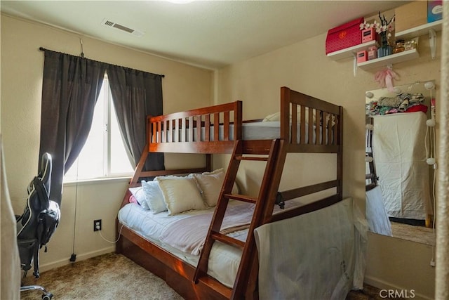 bedroom with light colored carpet