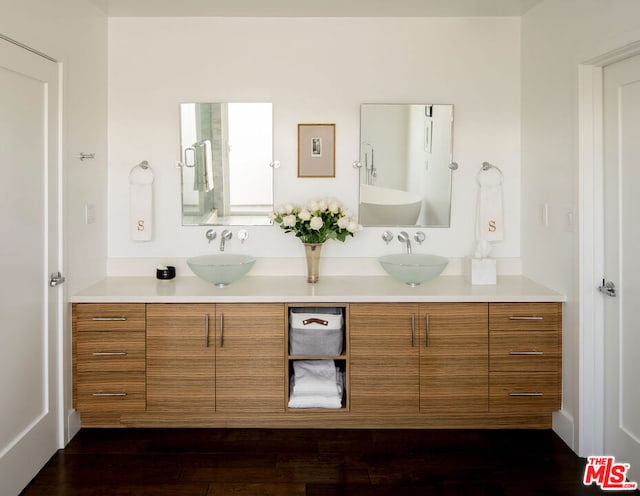 bathroom featuring hardwood / wood-style flooring and vanity