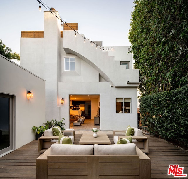 deck featuring outdoor lounge area