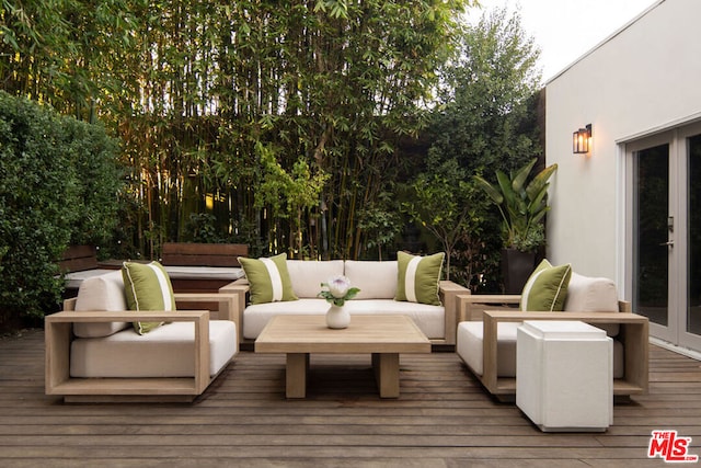 deck with an outdoor living space and french doors