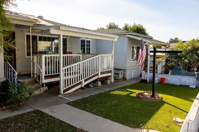 view of front of property with a front yard and a porch