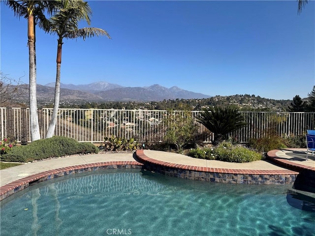 view of pool featuring a mountain view