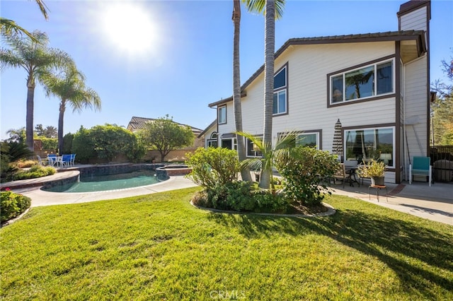 exterior space featuring a patio and a lawn