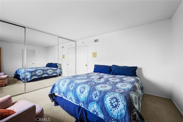 bedroom featuring carpet floors and a closet