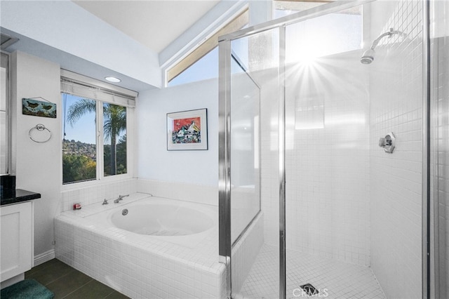 bathroom with vanity, independent shower and bath, and tile patterned flooring