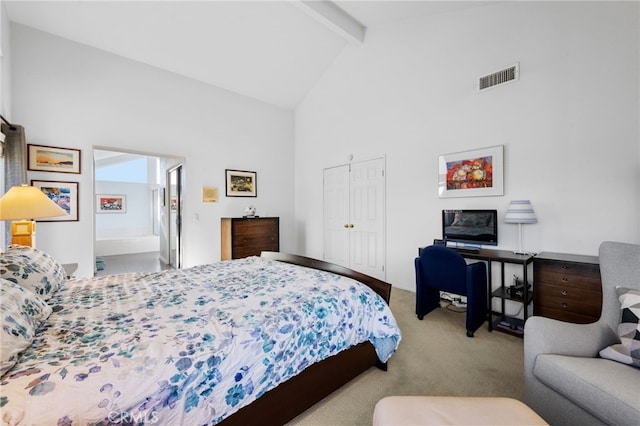 carpeted bedroom with beam ceiling and high vaulted ceiling