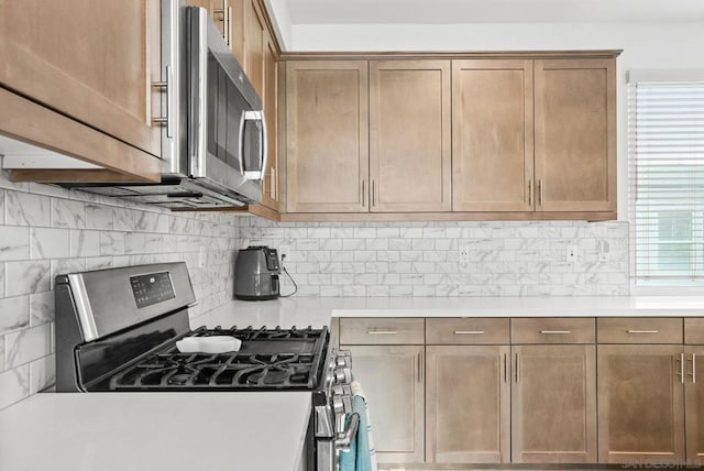 kitchen featuring decorative backsplash and stainless steel appliances