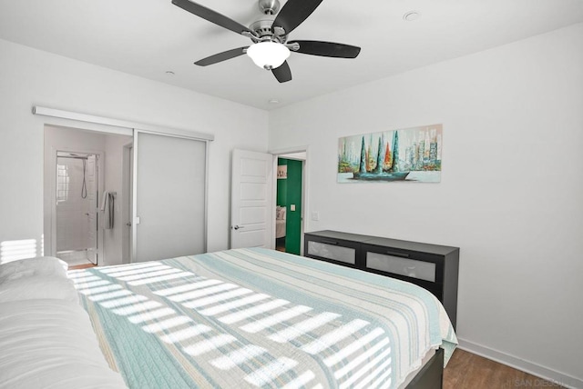 bedroom with ceiling fan, a closet, and dark hardwood / wood-style floors