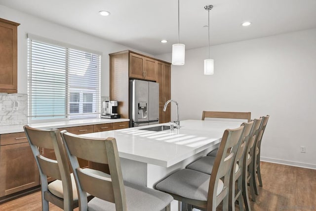 dining area featuring sink and hardwood / wood-style flooring