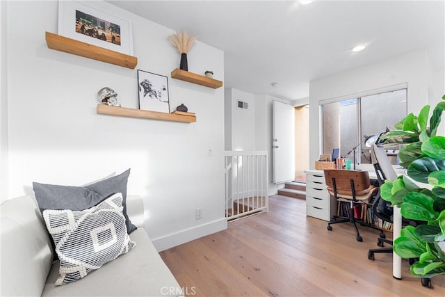 home office with light wood-type flooring