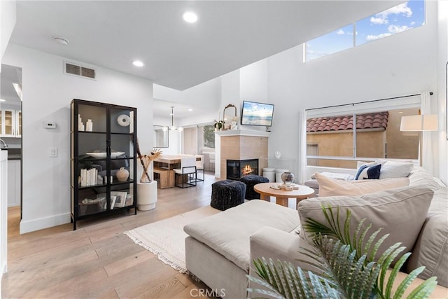 living room featuring a fireplace and light hardwood / wood-style flooring