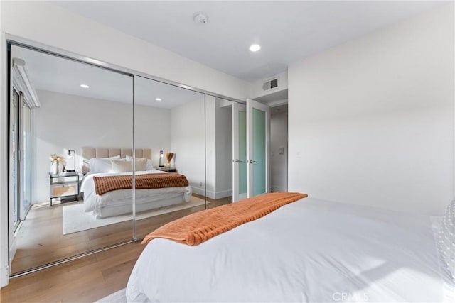 bedroom with a closet and light wood-type flooring