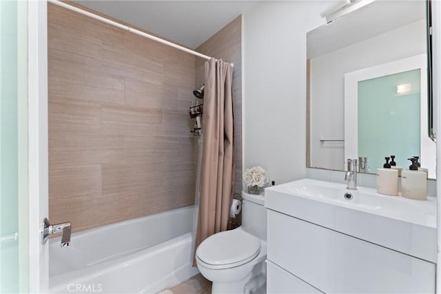 full bathroom with toilet, vanity, and shower / tub combo with curtain