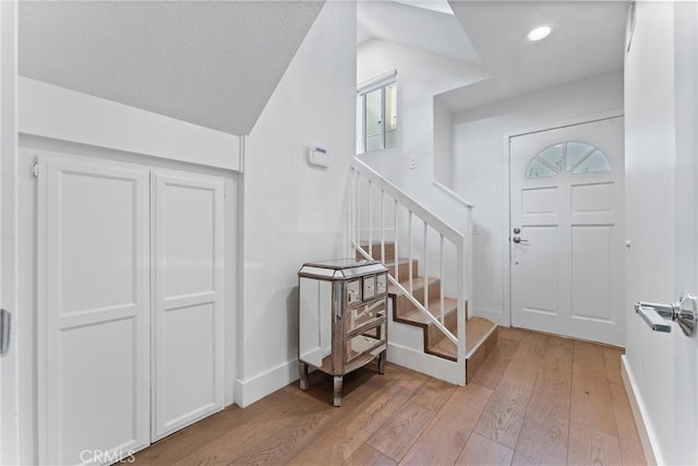 entryway with light hardwood / wood-style floors