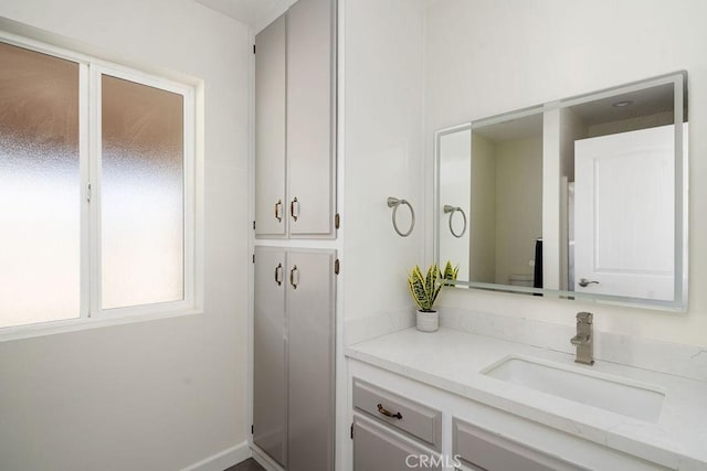 bathroom featuring toilet and vanity