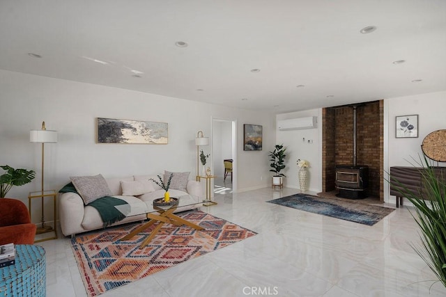 6124 Juniper Rd, Lake Isabella, CA 93240 - living area featuring an AC wall unit, a wood stove, recessed lighting, and light marble finish flooring