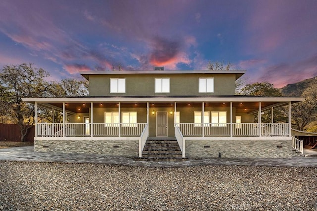 country-style home featuring covered porch