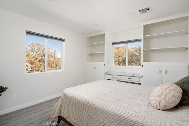 bedroom featuring dark wood-type flooring