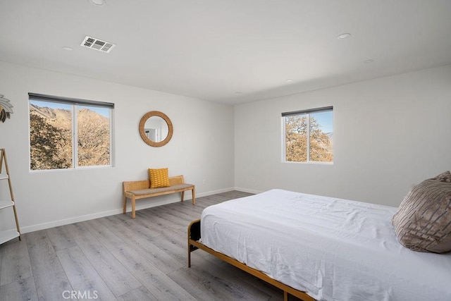 6124 Juniper Rd, Lake Isabella, CA 93240 - bedroom with multiple windows, wood finished floors, baseboards, and recessed lighting