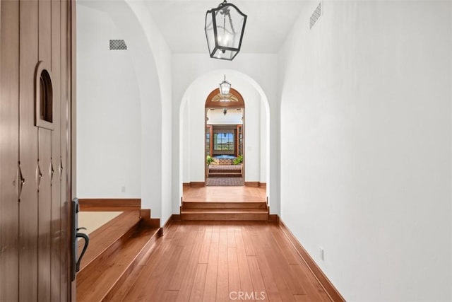 hallway with wood-type flooring