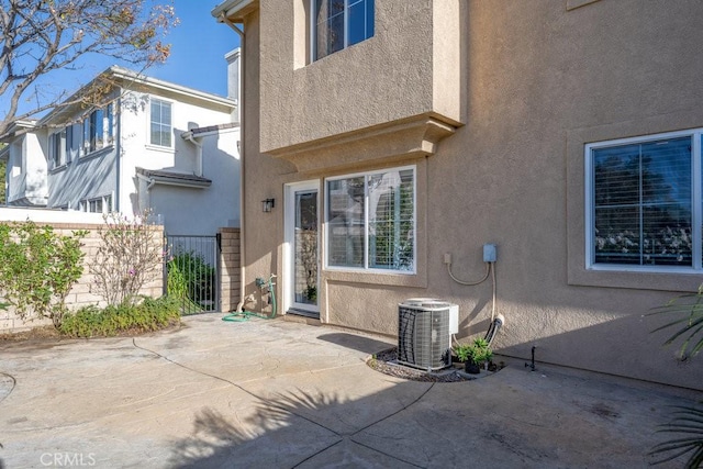 back of house featuring a patio and central AC