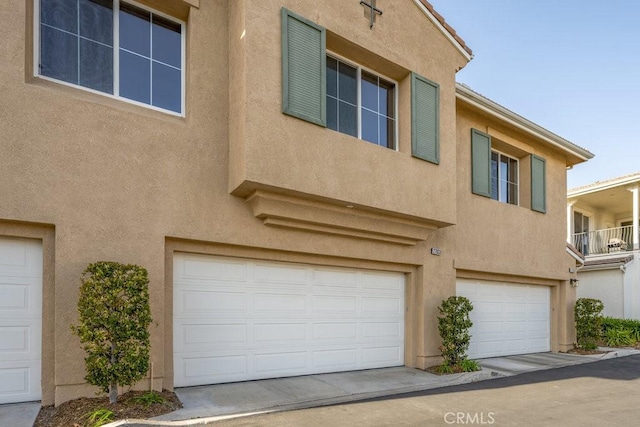 multi unit property featuring a garage