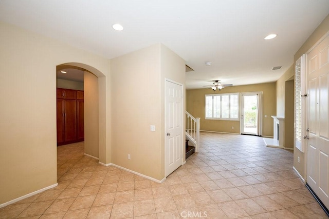 hall with light tile patterned floors