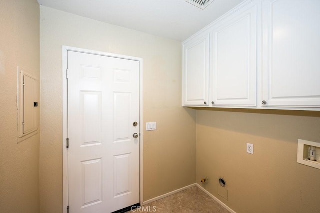 laundry area with hookup for a washing machine, cabinets, electric panel, and light tile patterned floors