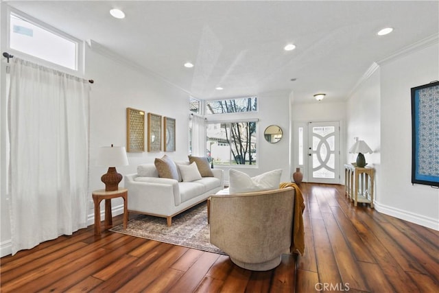 living room with dark hardwood / wood-style floors and crown molding