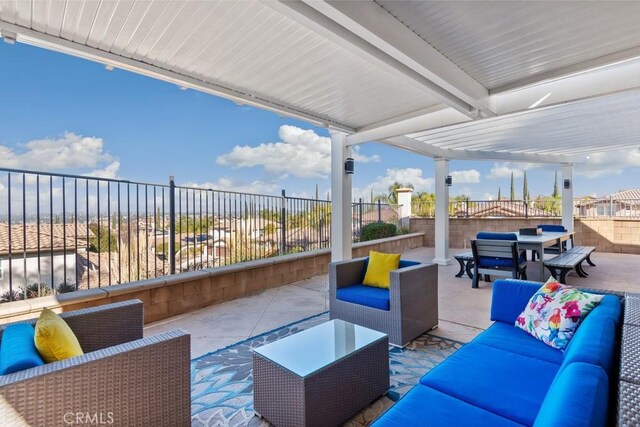 view of patio with an outdoor living space and a pergola