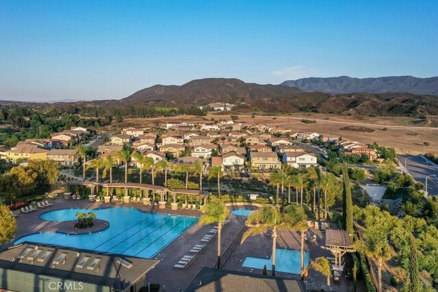 birds eye view of property with a mountain view